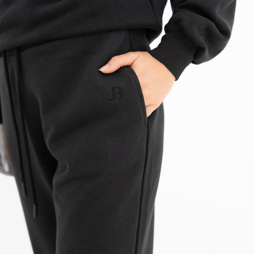 Black tracksuit, close up picture