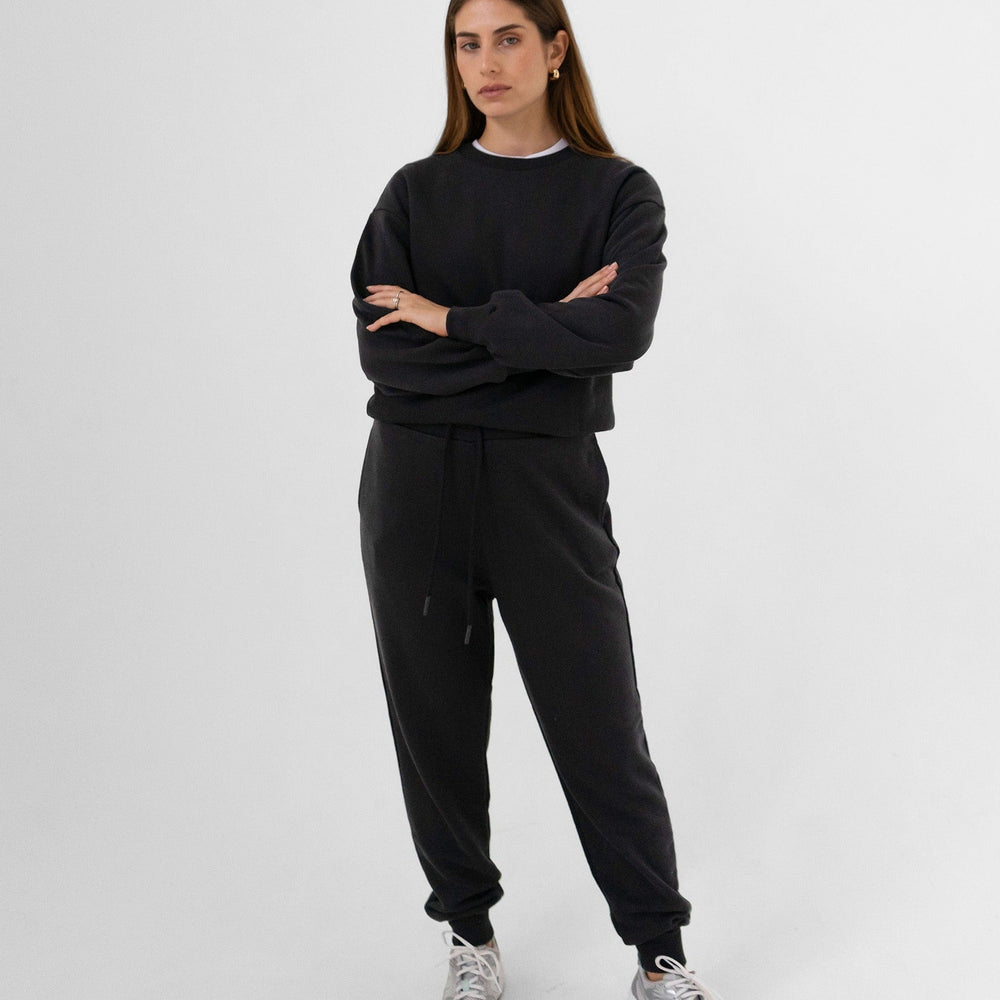 
                      
                        Black tracksuit, full body picture
                      
                    